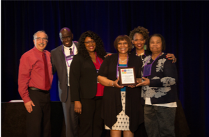 Photo of A delegation from Tennessee accepting an award from Gerry Hanley and Moustapha Diack:  Tokesha Warner (Tennessee State), Audie Black (Tennessee State), Robbie Melton, Denise Malloy (Southwest Tennessee).
